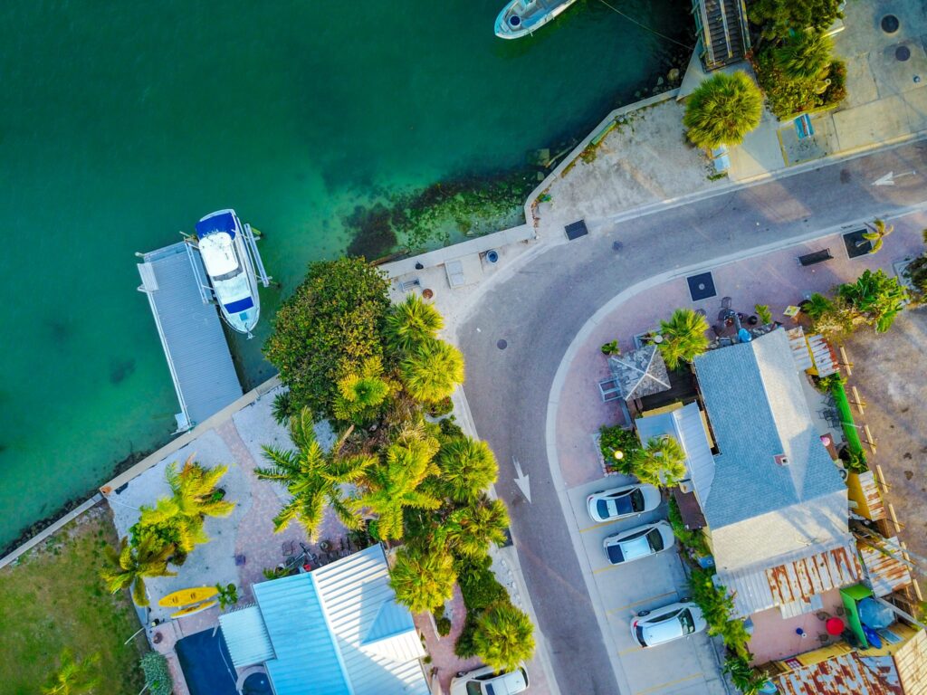 Drone aerial view of a waterside road by mdburnette is licensed under CC-CC0 1.0