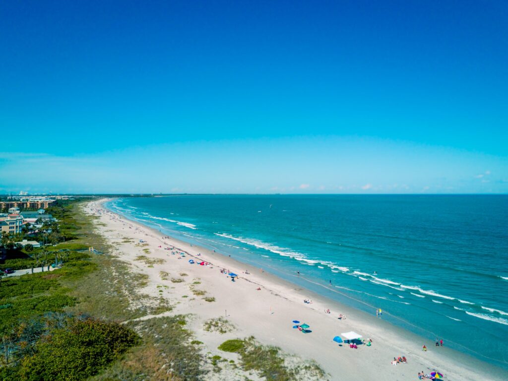 Drone photo over the beach at Port Canaveral in Florida by mdburnette is licensed under CC-CC0 1.0